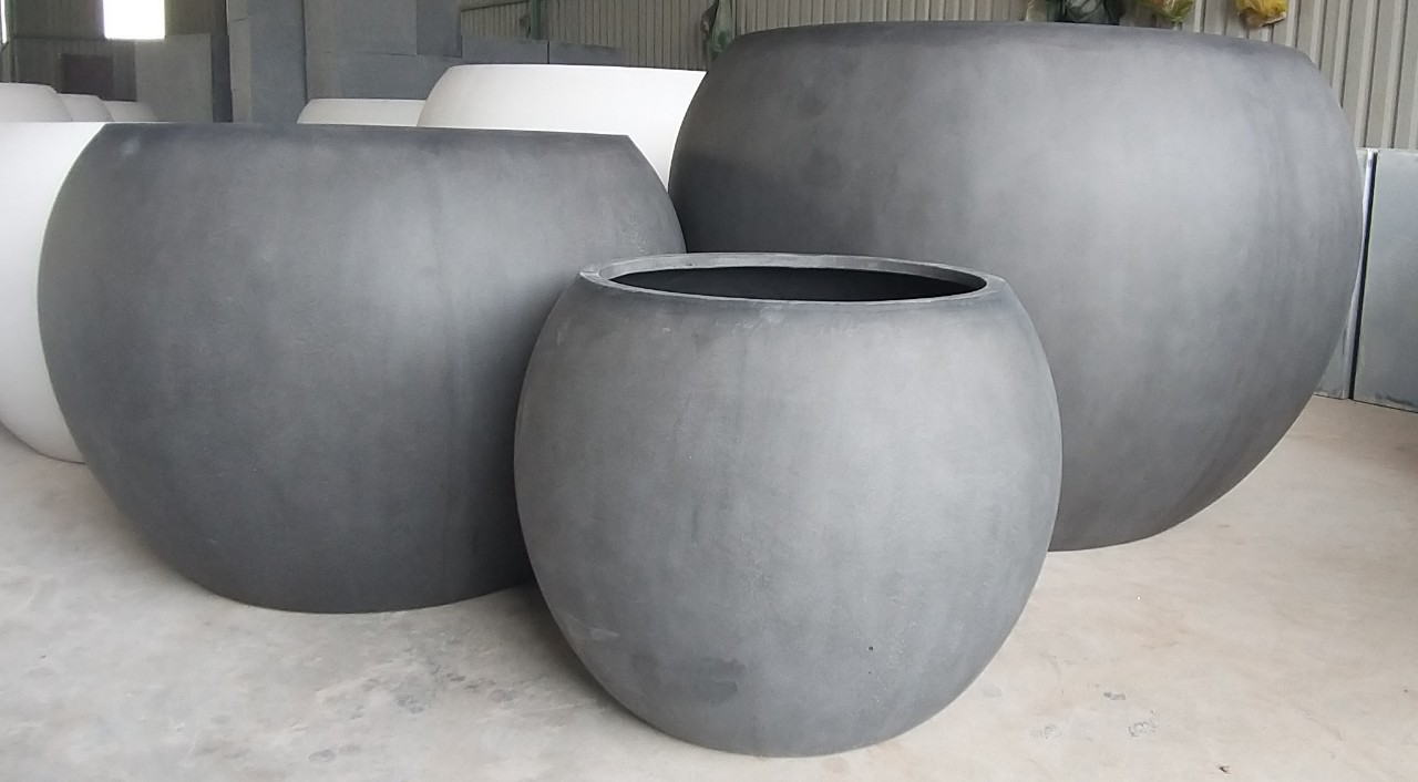 Large polystone planters manufactured in Vietnam for hospitality commercial and landscape projects