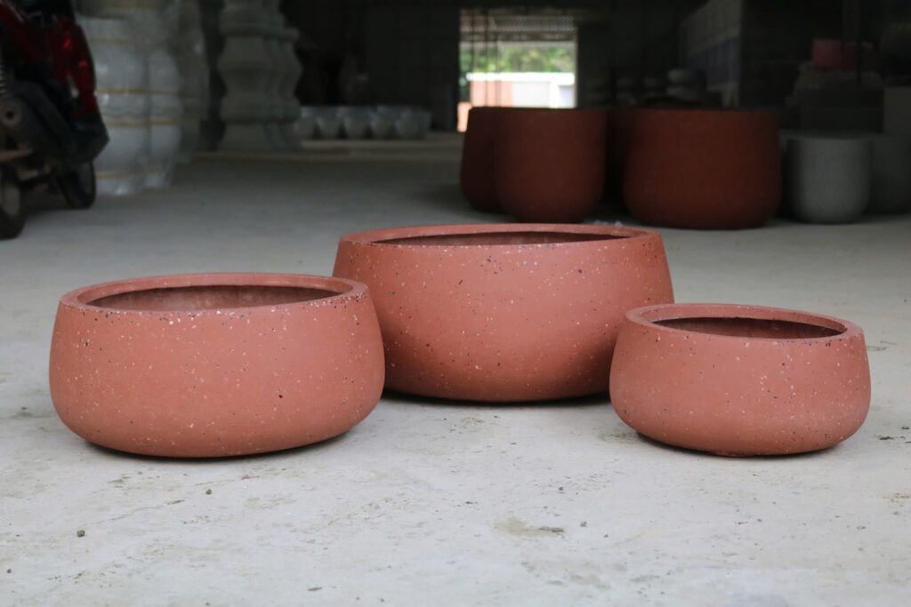 Lightweight fiberglass planters manufactured in Vietnam for commercial hospitality and landscape projects