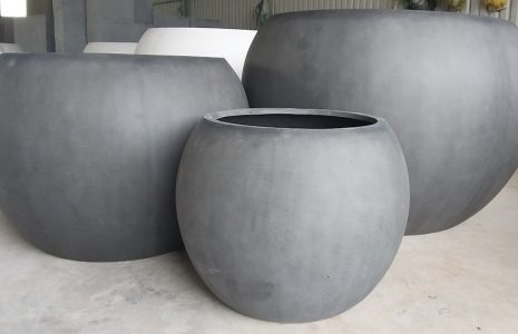 Large polystone planters manufactured in Vietnam for hospitality commercial and landscape projects
